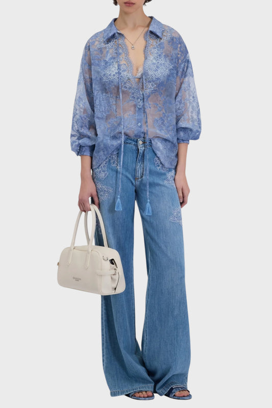 Jeans flare da donna con ricami in pizzo sui fianchi