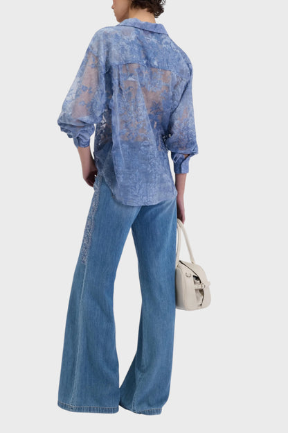 Jeans flare da donna con ricami in pizzo sui fianchi
