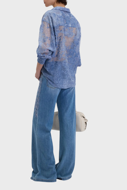 Jeans flare da donna con ricami in pizzo sui fianchi