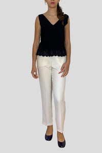 Top smanicato con rouche crochet