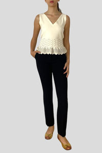Top smanicato con rouche crochet